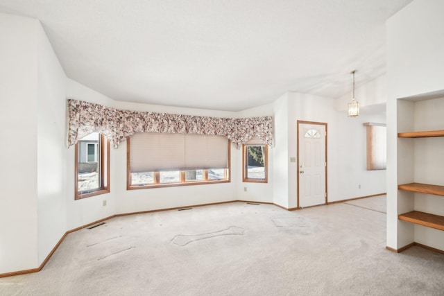2513 Sumac Rdg, White Bear Lake, MN 55110 - carpeted spare room featuring baseboards