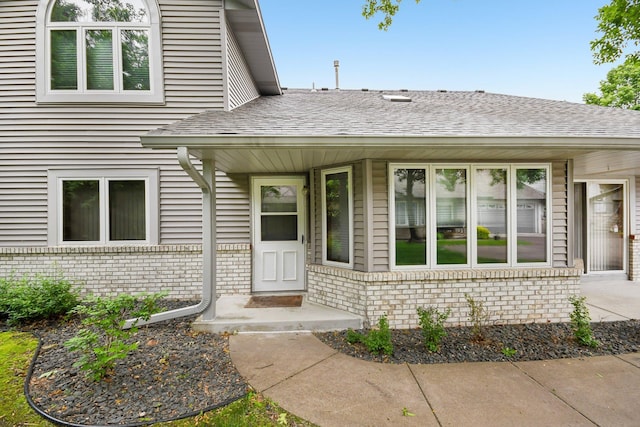 2513 Sumac Rdg, White Bear Lake, MN 55110 - view of exterior entry featuring brick siding and roof with shingles