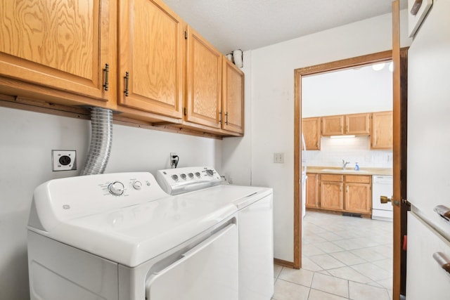 2513 Sumac Rdg, White Bear Lake, MN 55110 - laundry room featuring cabinet space, light tile patterned floors, and washing machine and dryer