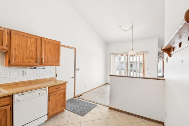 2513 Sumac Rdg, White Bear Lake, MN 55110 - kitchen with white dishwasher, backsplash, brown cabinetry, light countertops, and high vaulted ceiling