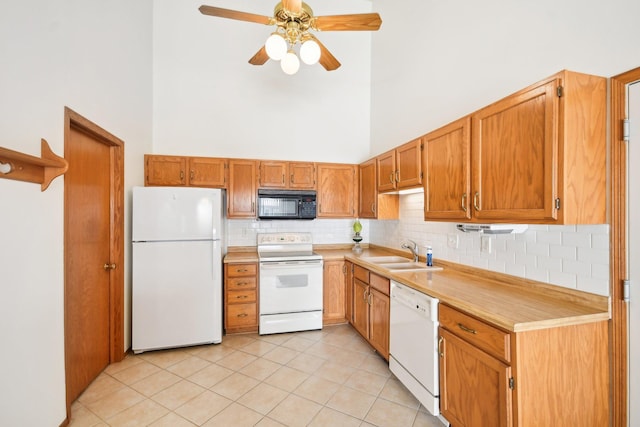 2513 Sumac Rdg, White Bear Lake, MN 55110 - kitchen with white appliances, a high ceiling, light countertops, ceiling fan, and light tile patterned flooring