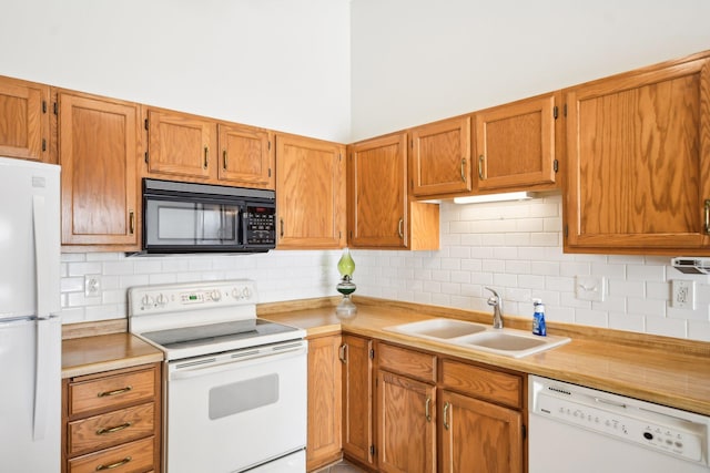 2513 Sumac Rdg, White Bear Lake, MN 55110 - kitchen featuring white appliances, decorative backsplash, and light countertops