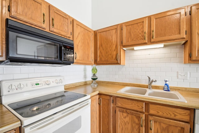 2513 Sumac Rdg, White Bear Lake, MN 55110 - kitchen with electric stove, black microwave, light countertops, decorative backsplash, and brown cabinetry
