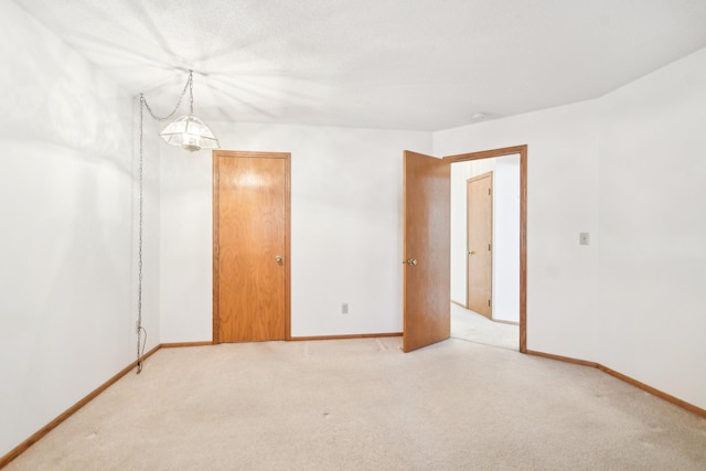 2513 Sumac Rdg, White Bear Lake, MN 55110 - spare room featuring light colored carpet and a smoke detector