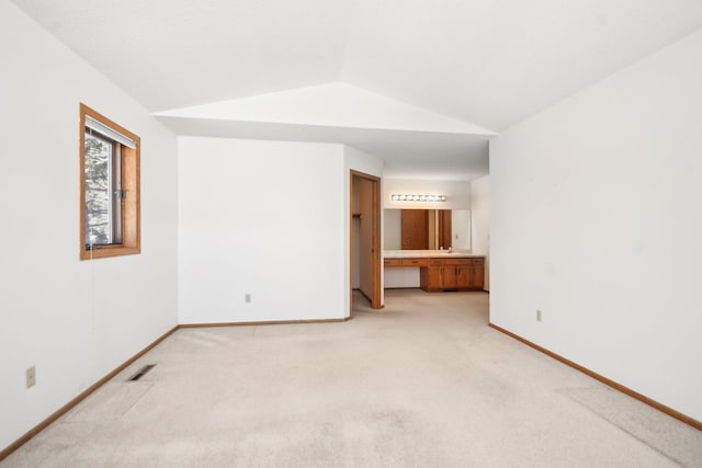 2513 Sumac Rdg, White Bear Lake, MN 55110 - empty room with lofted ceiling and light colored carpet