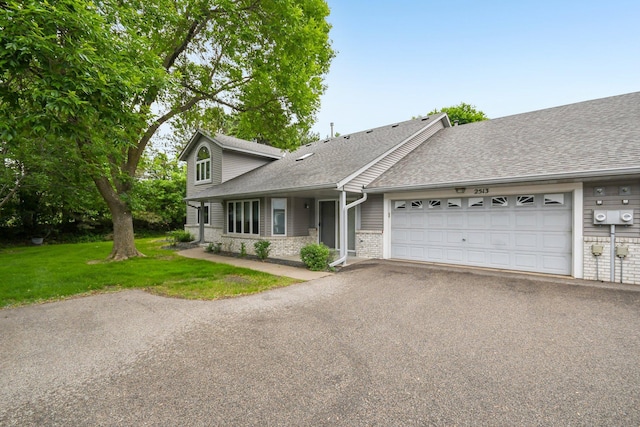 2513 Sumac Rdg, White Bear Lake, MN 55110 - view of front of house featuring a garage, driveway, a front yard, roof with shingles, and brick siding