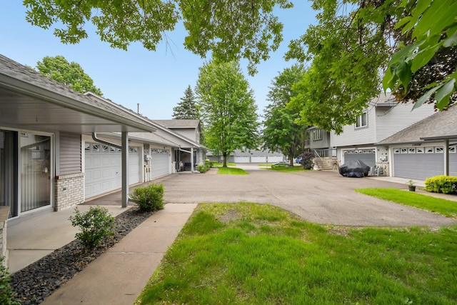 2513 Sumac Rdg, White Bear Lake, MN 55110 - view of yard featuring a garage