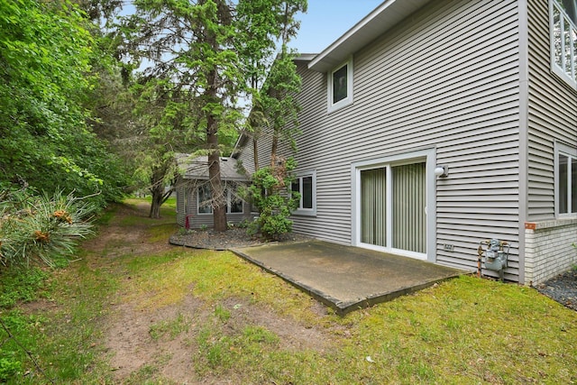 2513 Sumac Rdg, White Bear Lake, MN 55110 - back of property featuring a patio area and a lawn