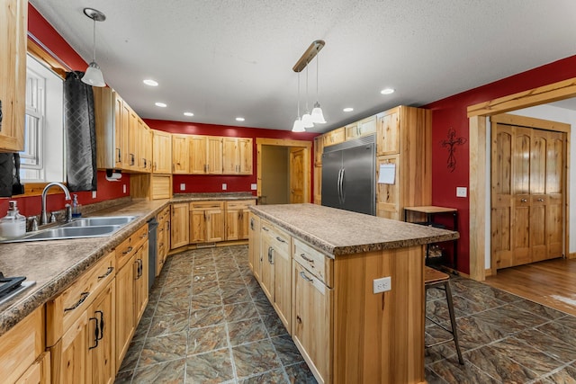 42118 Lowden Ave, Sunrise Twp, MN 55032 - kitchen featuring built in refrigerator, a kitchen island, a kitchen breakfast bar, pendant lighting, and recessed lighting
