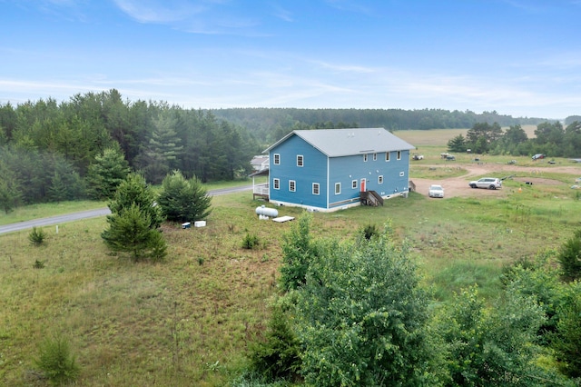 42118 Lowden Ave, Sunrise Twp, MN 55032 - aerial view of property and surrounding area featuring a heavily wooded area