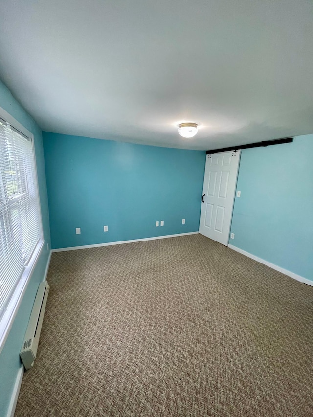 10244 State Highway 87, Blueberry Twp, MN 56464 - carpeted empty room featuring a baseboard heating unit and baseboards