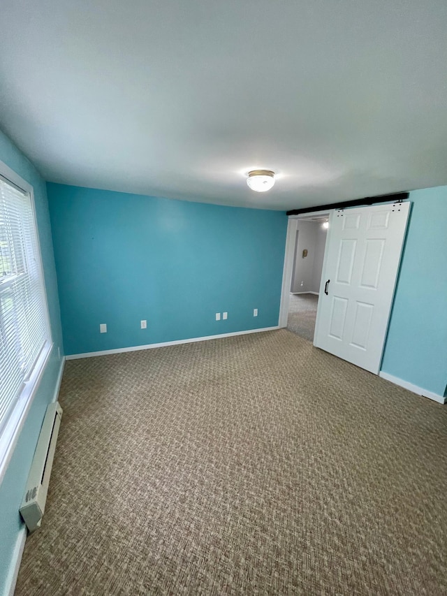10244 State Highway 87, Blueberry Twp, MN 56464 - unfurnished room with baseboard heating and carpet flooring