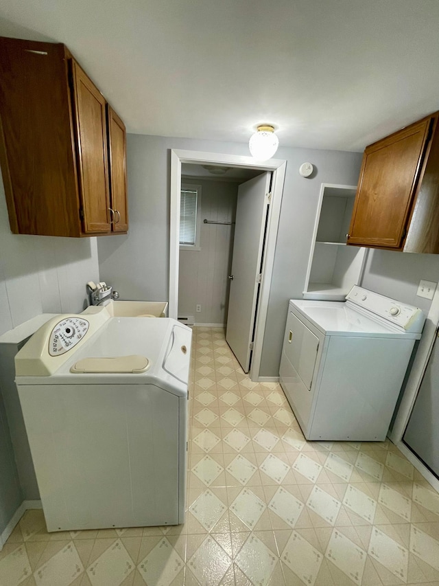 10244 State Highway 87, Blueberry Twp, MN 56464 - washroom featuring washer and clothes dryer, light floors, and cabinet space