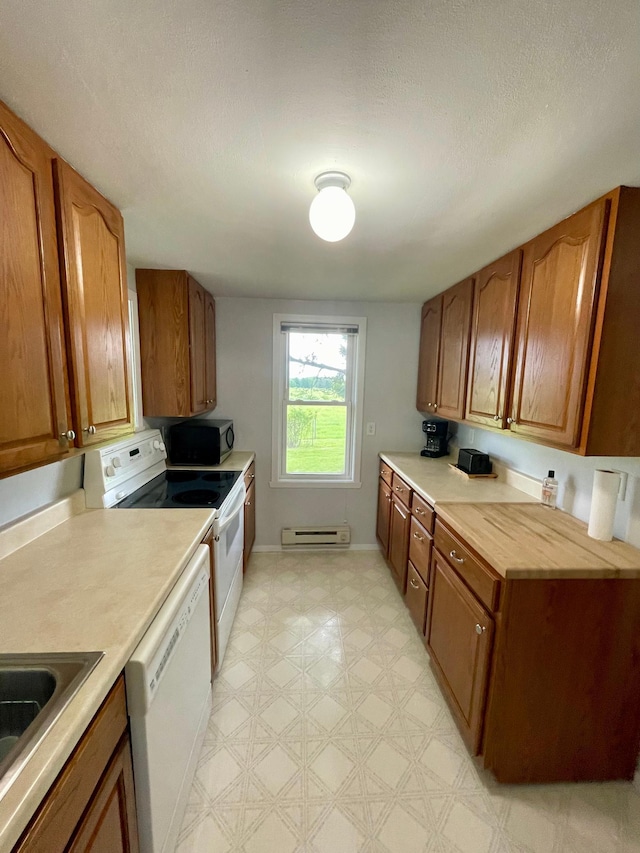 10244 State Highway 87, Blueberry Twp, MN 56464 - kitchen with white appliances, baseboard heating, and brown cabinets