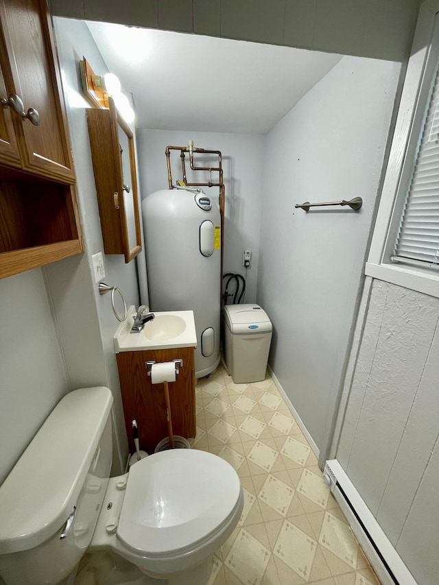 10244 State Highway 87, Blueberry Twp, MN 56464 - half bath featuring vanity, a baseboard heating unit, tile patterned floors, and water heater