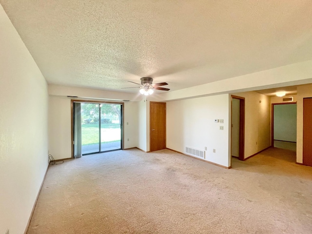 401 County Road 5 Unit 102, Springfield, MN 56087 - spare room featuring a ceiling fan, a textured ceiling, and light colored carpet