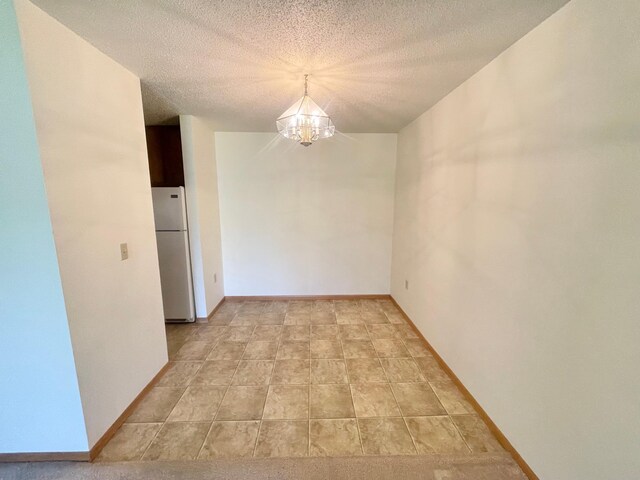 401 County Road 5 Unit 102, Springfield, MN 56087 - empty room with a chandelier and a textured ceiling