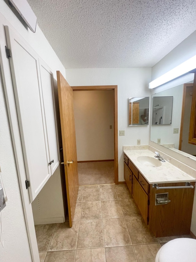 401 County Road 5 Unit 102, Springfield, MN 56087 - bathroom with a textured ceiling, vanity, and tile patterned floors