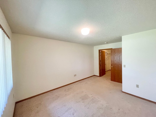 401 County Road 5 Unit 102, Springfield, MN 56087 - unfurnished room featuring light colored carpet and a textured ceiling