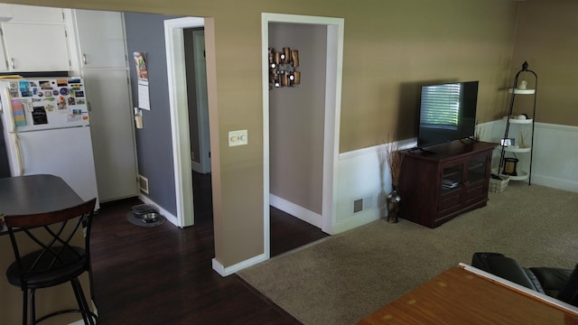 524 1st Ave SE, Wells, MN 56097 - living area with a wainscoted wall and wood finished floors
