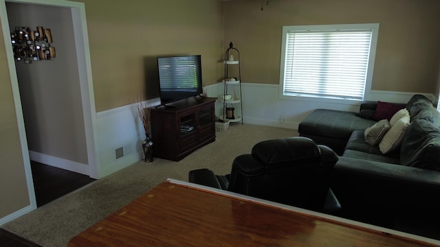 524 1st Ave SE, Wells, MN 56097 - living area featuring a wainscoted wall and carpet flooring