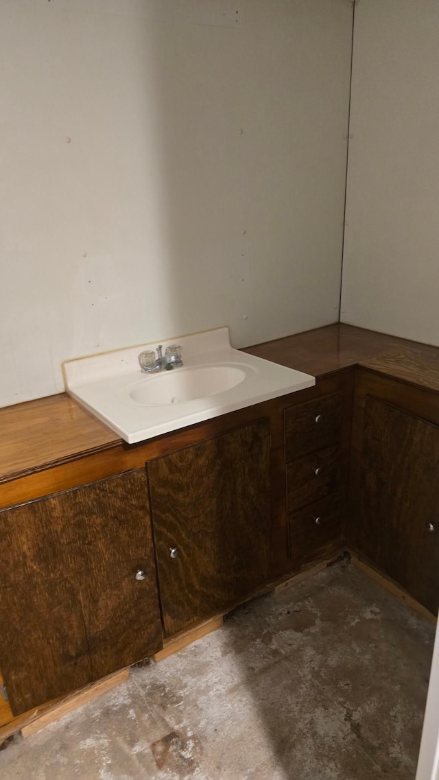 524 1st Ave SE, Wells, MN 56097 - bathroom featuring vanity and concrete flooring