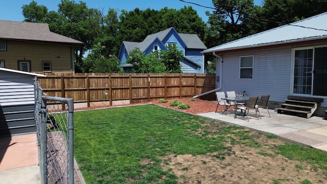 524 1st Ave SE, Wells, MN 56097 - fenced backyard featuring a patio area, entry steps, and an outdoor structure