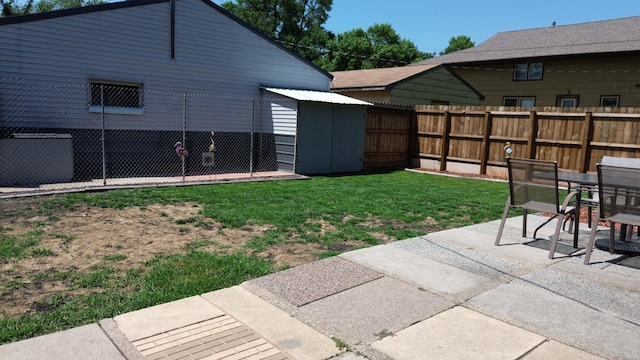 524 1st Ave SE, Wells, MN 56097 - fenced backyard with a patio area and a storage unit
