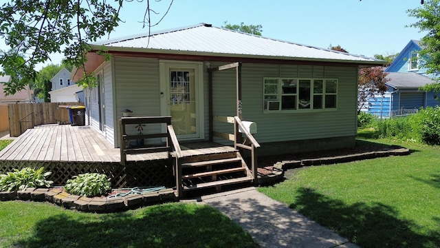 524 1st Ave SE, Wells, MN 56097 - back of property featuring a metal roof and a deck