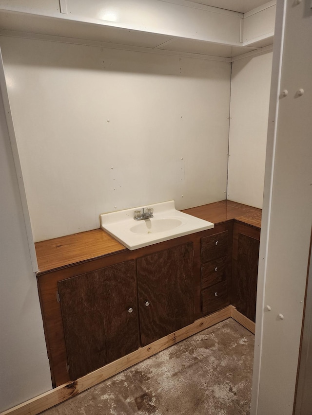 524 1st Ave SE, Wells, MN 56097 - bathroom featuring concrete flooring and vanity