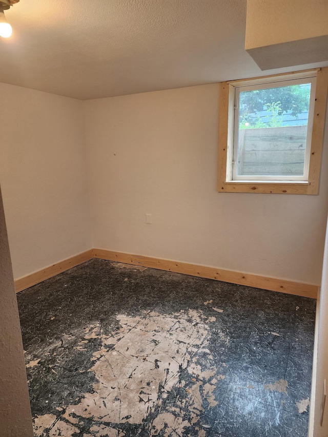 524 1st Ave SE, Wells, MN 56097 - spare room featuring baseboards