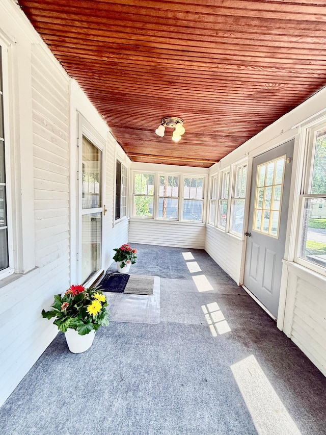 2112 Manitou Ave, Saint Paul, MN 55119 - unfurnished sunroom featuring wood ceiling and carpet