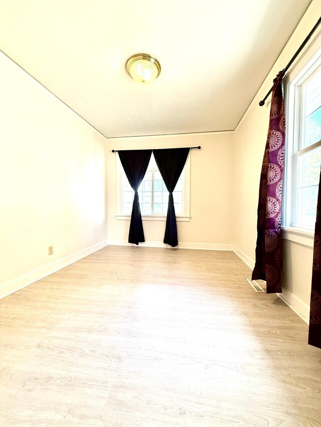 2112 Manitou Ave, Saint Paul, MN 55119 - unfurnished room featuring wood finished floors and plenty of natural light