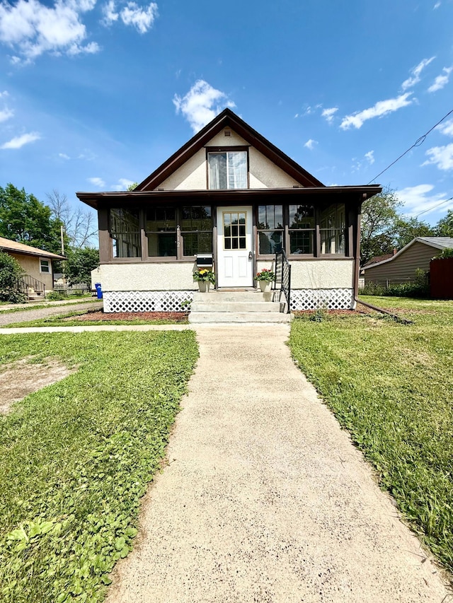 2112 Manitou Ave, Saint Paul, MN 55119 - view of front of home with a front lawn and stucco siding