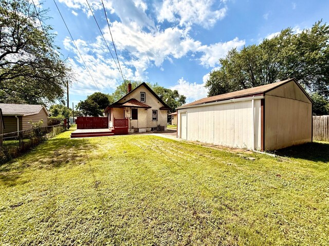 2112 Manitou Ave, Saint Paul, MN 55119 - view of yard with a deck and an outdoor structure