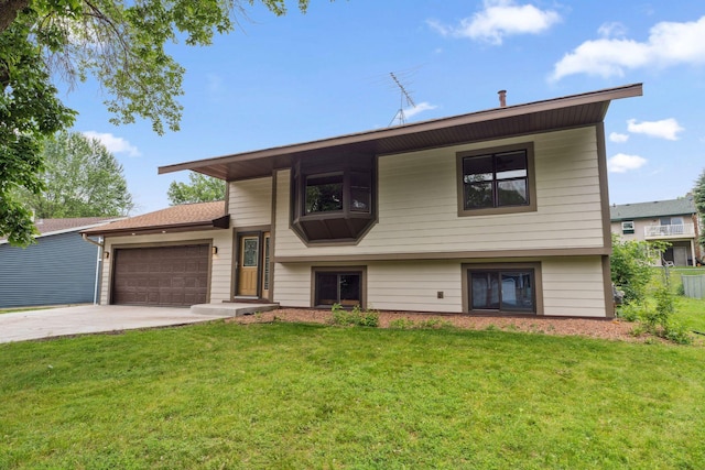 6636 Lancaster Ln N, Maple Grove, MN 55369 - view of front of property featuring concrete driveway, a garage, and a front lawn