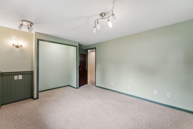 6636 Lancaster Ln N, Maple Grove, MN 55369 - unfurnished bedroom featuring carpet flooring, a textured ceiling, a closet, and a ceiling fan