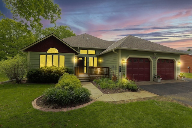 1805 7th Ave N, Sartell, MN 56377 - view of front facade with an attached garage, asphalt driveway, a front lawn, and roof with shingles