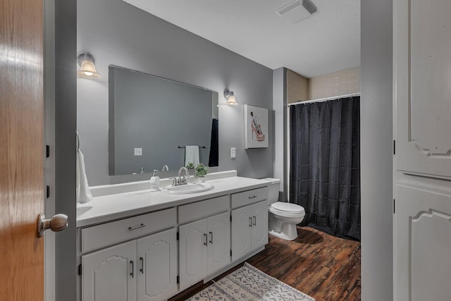 1805 7th Ave N, Sartell, MN 56377 - bathroom with vanity, wood finished floors, and a shower with curtain