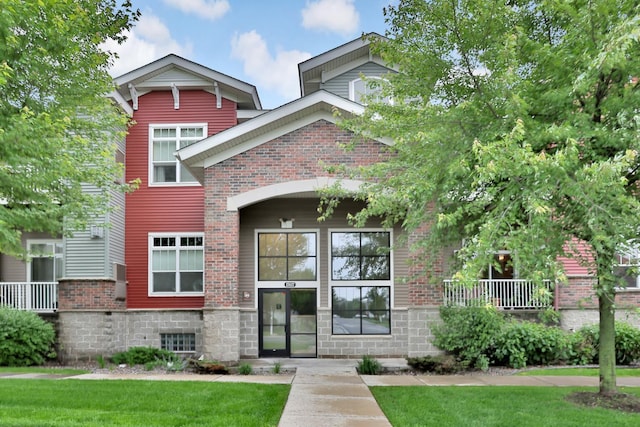 17417 72nd Ave N Unit 205, Maple Grove, MN 55311 - view of front facade featuring brick siding and a front yard