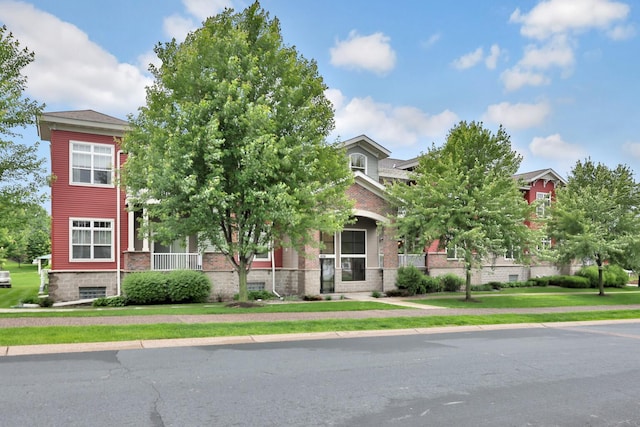 17417 72nd Ave N Unit 205, Maple Grove, MN 55311 - view of property hidden behind natural elements featuring brick siding and a front yard