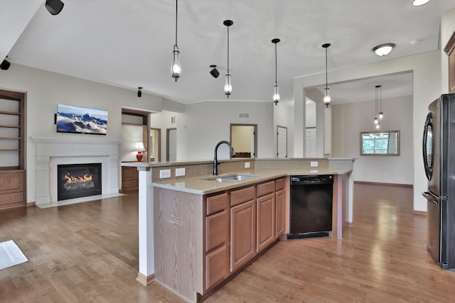 17417 72nd Ave N Unit 205, Maple Grove, MN 55311 - kitchen with black appliances, open floor plan, light wood-style floors, and a fireplace with flush hearth