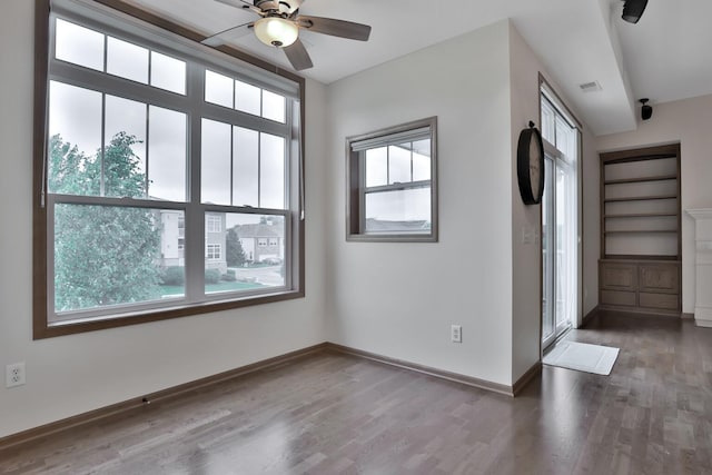 17417 72nd Ave N Unit 205, Maple Grove, MN 55311 - empty room featuring plenty of natural light, wood finished floors, and a ceiling fan