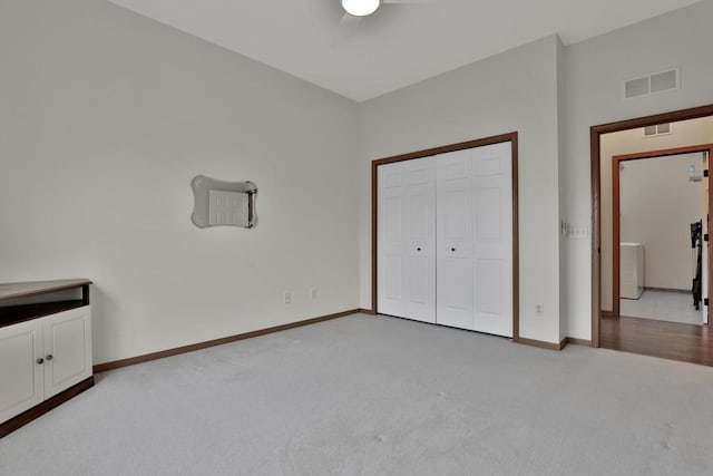 17417 72nd Ave N Unit 205, Maple Grove, MN 55311 - unfurnished bedroom featuring light carpet, ceiling fan, and a closet