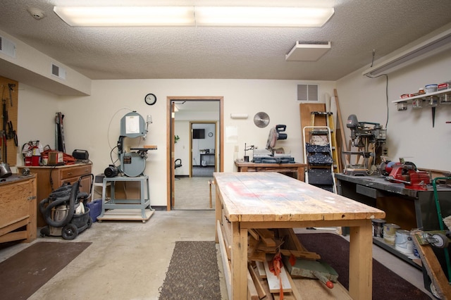 1415 Lake St Unit 114, Alexandria, MN 56308 - dining space with a workshop area, concrete floors, and a textured ceiling