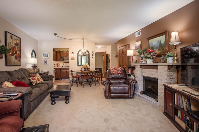 1415 Lake St Unit 114, Alexandria, MN 56308 - living room featuring light carpet and a fireplace