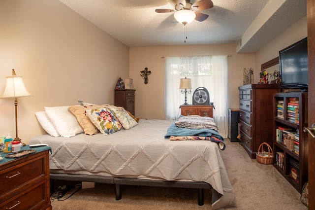 1415 Lake St Unit 114, Alexandria, MN 56308 - bedroom featuring light colored carpet, a ceiling fan, and a textured ceiling