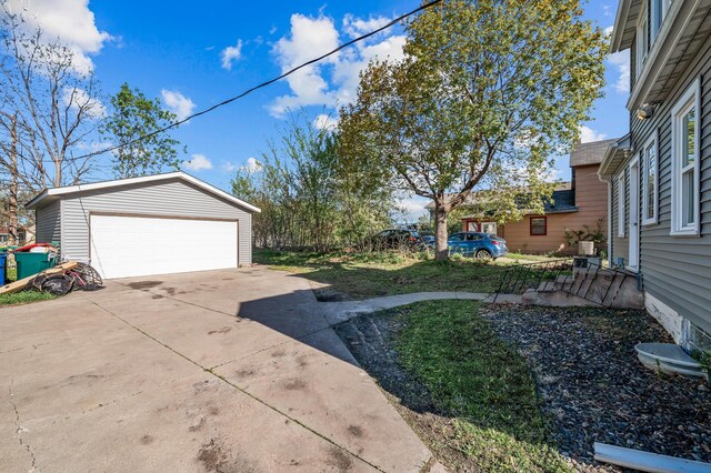 3806 Jackson St NE, Columbia Heights, MN 55421 - view of yard featuring an outdoor structure and a detached garage