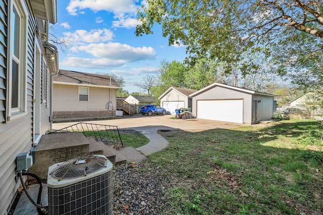 3806 Jackson St NE, Columbia Heights, MN 55421 - view of grassy yard with an outbuilding and a garage
