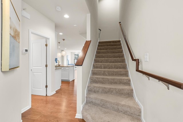 732 Wildflower Ln, Chanhassen, MN 55317 - stairway featuring wood finished floors and recessed lighting